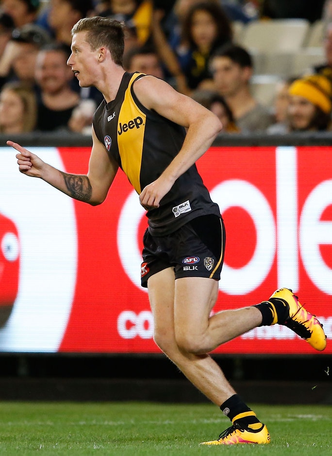 AFL 2016 Rd 01 - Richmond v Carlton MELBOURNE, AUSTRALIA - MARCH 24: Connor Menadue of the Tigers celebrates a goal during the 2016 AFL Round 01 match between the Richmond Tigers and the Carlton Blues at the Melbourne Cricket Ground, Melbourne on March 24, 2016. (Photo by Adam Trafford/AFL Media)